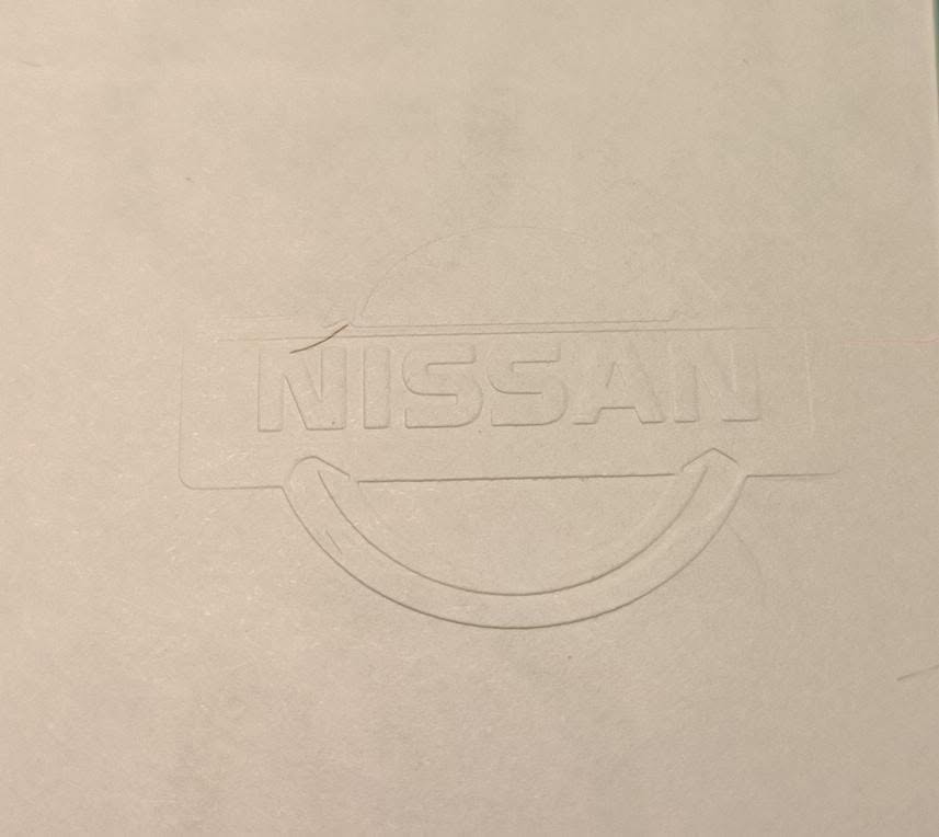 Papel seguridad relieve nissan